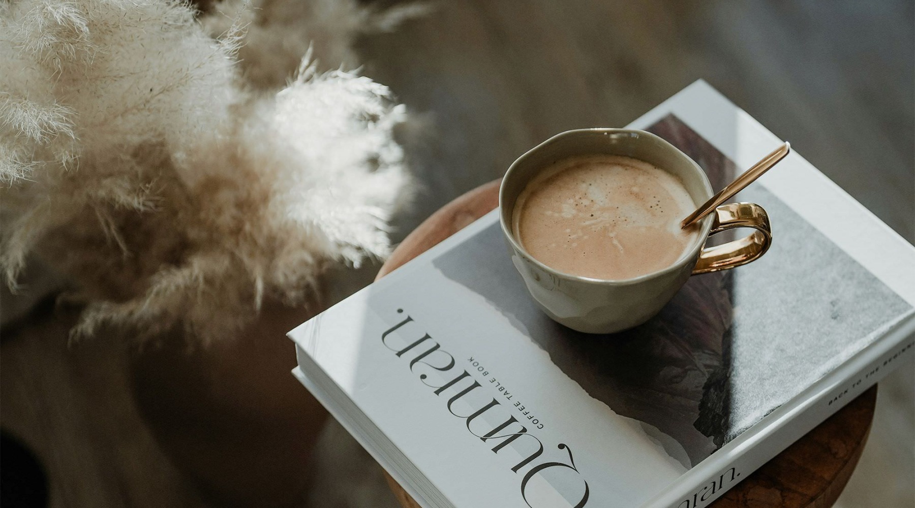 a cup of coffee on a book
